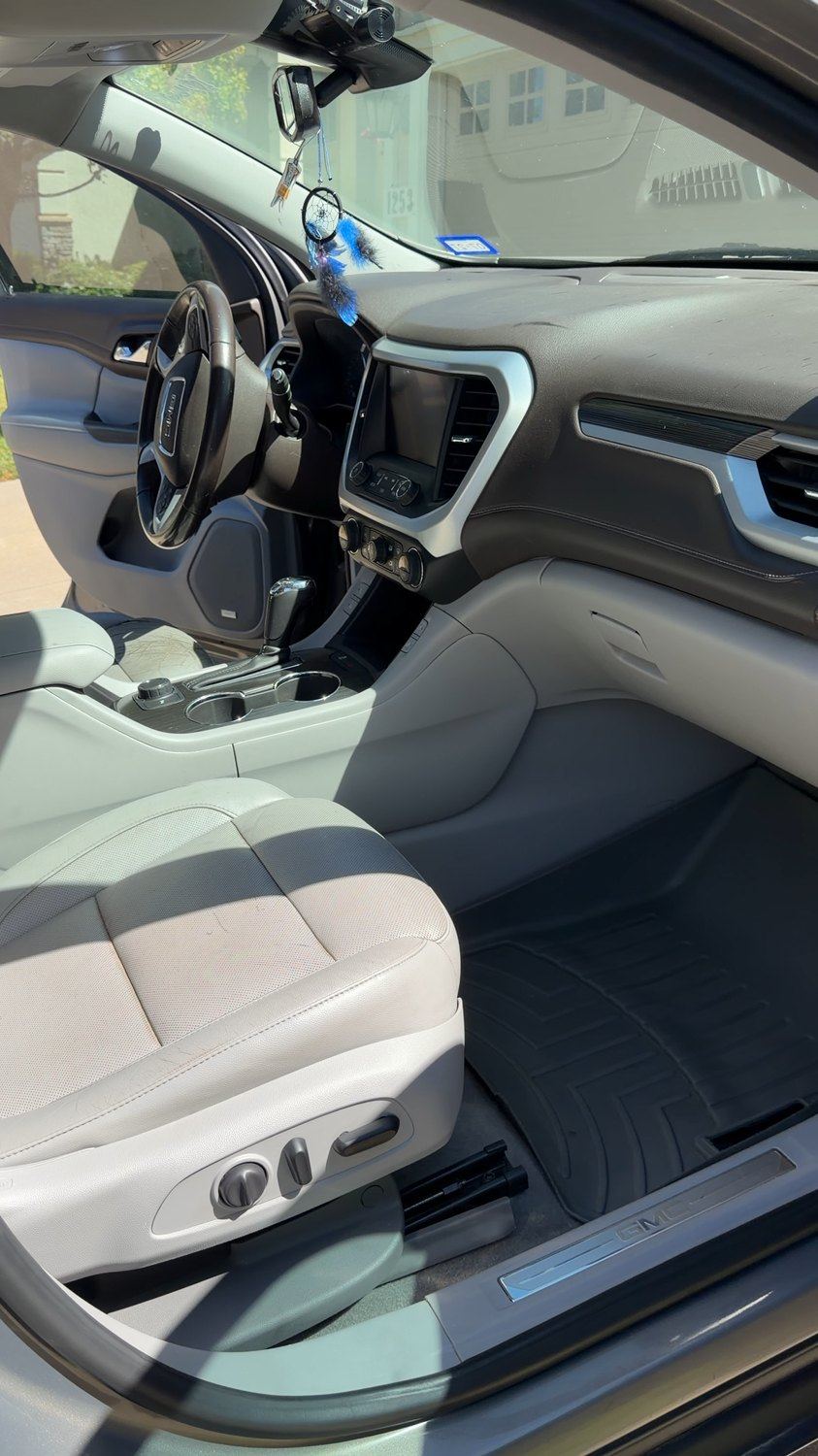 Clean light leather seats and dashboard after detailing