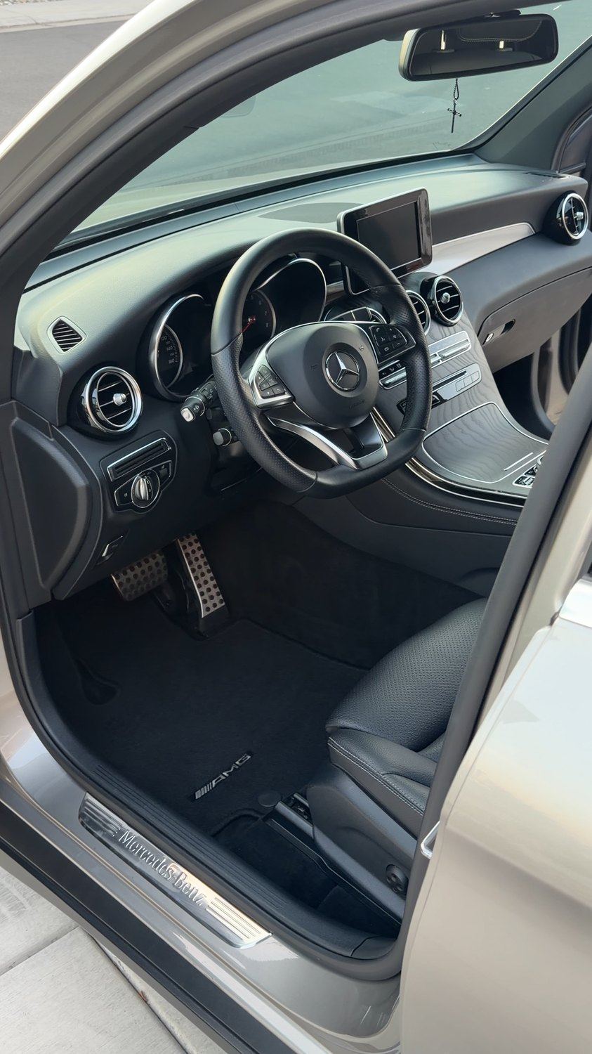 Clean black leather interior of a Mercedes